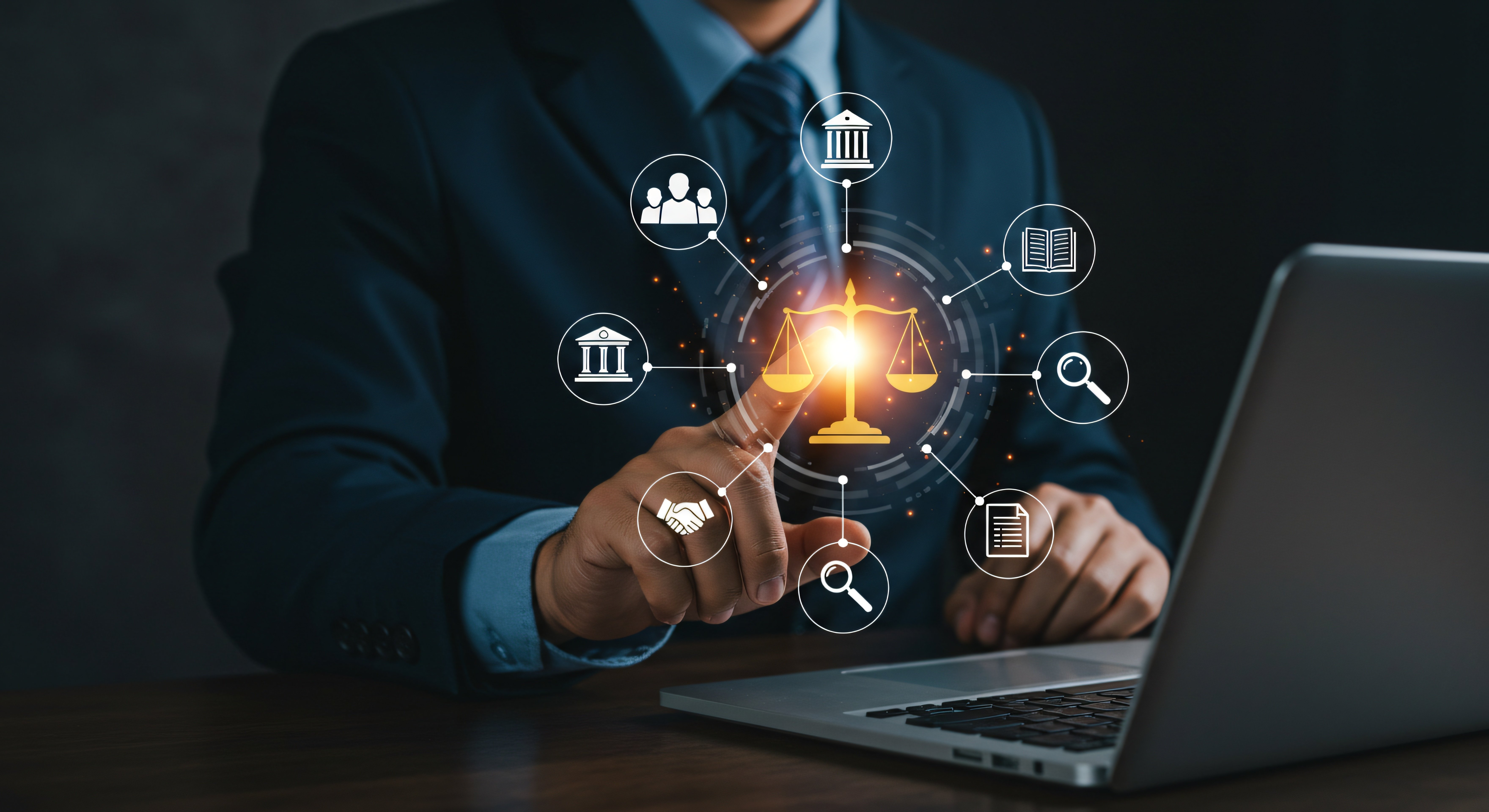 A man in a suit sitting at a laptop touching a superimposed hub of icons surrounding a glowing rendering of the Scales of Justice.